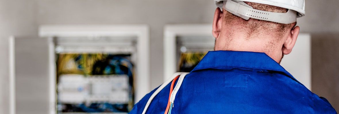 Electrician with Cables over Shoulder 1 - Grounded North Electrical Electrician with Cables over Shoulder 1